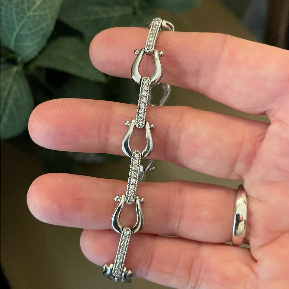 Dazzling Silver Equestrian-inspired Bracelet with Crystal Detailing